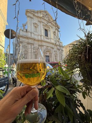 Outdoor seating in front of the church of st. Andrew  at Buddy VEGGY in Rome