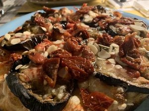 Vegan pizza w/ eggplant, mozzarella, sun dried tomato and almond flakes at Buddy VEGGY in Rome