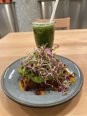 Avocado on toast- their homemade bread and so many lovely extra garnishes on the meal. The drink is a detox juice and it tasted great!  at roots - Lintheschergasse in Zurich