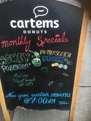 Sidewalk board at Cartems Donuts - Main St in Vancouver