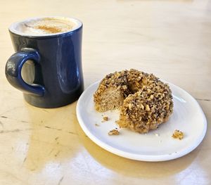 Pumpkin Spiced Latte and Maple Walnut Dougnut at Cartems Donuts - Main St in Vancouver