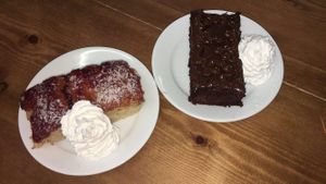 raspberry coconut cake and chocolate brownie with whipped cream at Oh My Goodness in Eastbourne