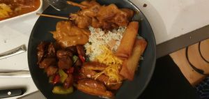 A mix of dishes with nasi and satay at De Oude Plek in Rotterdam