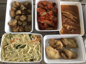 From left to right and up to down : Koe loe yuk, char chiew, babi pangang, bami and deep fried banana's. at De Oude Plek in Rotterdam