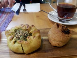 Savory pastries, one with spinach and cream, the other with eggplant and tomato at La Margherita in Bologna