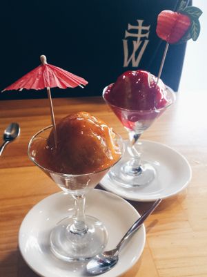 deep fried ice cream with caramel and strawberry topping. at Golden Lotus Vegan in Newtown