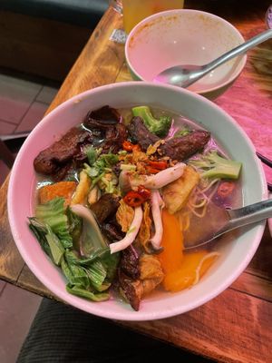 V duck yellow noodle soup, and an empty bowl of Tom yum soup   at Golden Lotus Vegan in Newtown