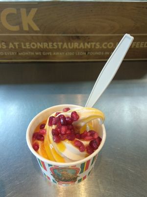 Passion fruit, lemongrass and pomegranate topping on vegan soft serve. Excellent! at LEON - Bankside in South East London