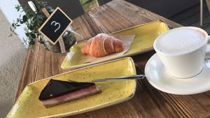 Vegan red fruits cheesecake and empty croissant at Bio Essere in Arco