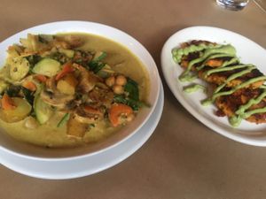 Coconut curry with a side of sweet potato cakes.  at 21 Oak in Manchester