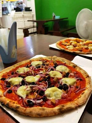 Pizza onion and wurstel at Pizzeria La Garganica in Bologna