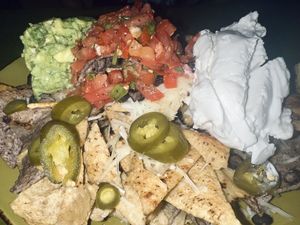 Vegan nachos w/ chee’se and sour cre’am  at Mad Mex in Erie