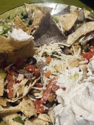 I personally like melted cheese on my nachos, not shredded cheese directly from the bag still cold and the rest of the nachos were kind of meh    at Mad Mex in Erie