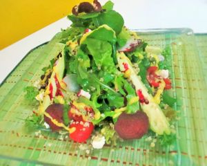 Fresh lettuce, avocado slices, pickled radish and carrot, aguaymanto, in passion fruit vinaigrette at Organika in Cusco