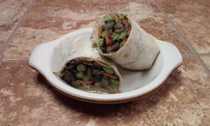 The Kayra Wrap - Pan Roasted, Mediterranean Marinated Vegetables lightly dressed with a Kefir, Garlic, Cucumber, Dill Sauce  at Organic Goddess Cafe in Palm Harbor