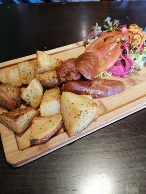 Vegan chorizo with potatoes and salad   at Recyclo Bike Cafe in Malaga