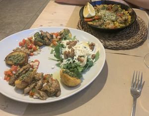 Provenzal dish in the front, paella in the back   at Vegetalia - Born in Barcelona