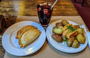 Dos empanadas y patatas bravas con sangria. at Vegetalia - Born in Barcelona
