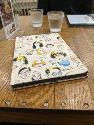 Menu cover at Apprivoiser Whole Food Cafe in Kyoto
