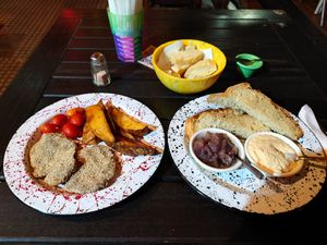 Milanesitas and Hummus dishes at Casa Munay in Buenos Aires