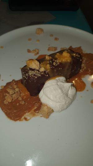 in fondo al caramello - Dark chocolate cremoso, covered in dark chocolate with cashew cream, salted caramel, and caramel whipped cream at Cavoli Nostri in Naples