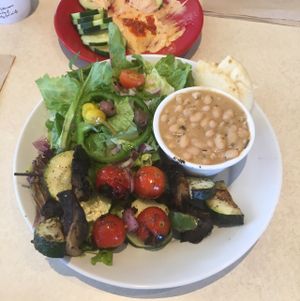 veggie kabobs, salad, and white bean w/rosemary  at Zoës Kitchen in Gainesville