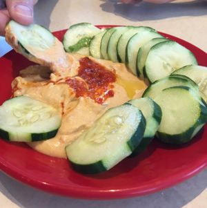red pepper hummus with cucumbers at Zoës Kitchen in Gainesville
