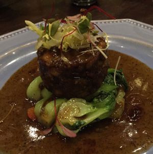 Seared Pom Pom Mushroom Steak with assorted vegetables.  at Herban Fix Vegan Kitchen in Atlanta