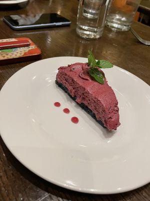 Some sort of cake with blueberry mousse  at Herban Fix Vegan Kitchen in Atlanta