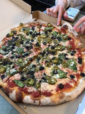 yummy pizza with daya cheese, olives, jalapenos annnd spinach  at Get Sum Pizza in Kailua Kona