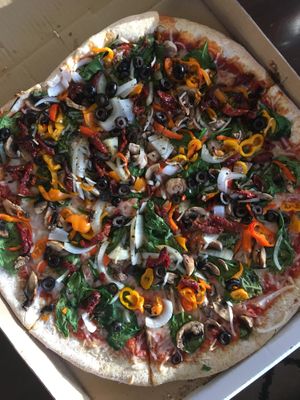 Veggie pizza with daiya cheese at Get Sum Pizza in Kailua Kona