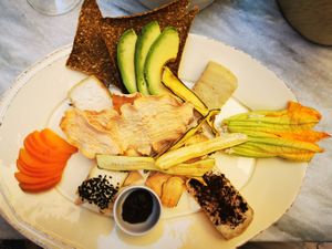 Plate of cheeses and tried vegetables at Botanica Lab in Bologna