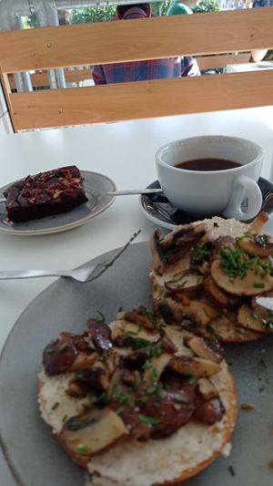 Garlic mushrooms on bagels, with a chocolate brownie chaser, washed down with coffee. at Rawberry in Winchester
