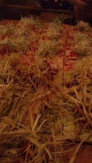 Front is vegan onion pizza and back is vegetarian pizza at Veggie Pizza - Miraflores  in Lima