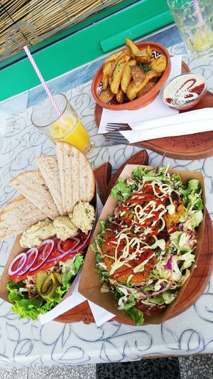 Hummus, chickpea fritters and potatoe wedges with vegan mayo and ketchup😍🥳🥳 at Public Bar & Vegan Kitchen in Bled
