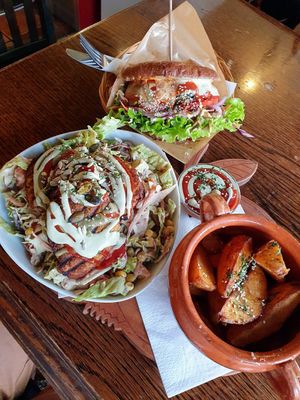 Burger with potatoes. Chickpea fritters on a salad bed. at Public Bar & Vegan Kitchen in Bled
