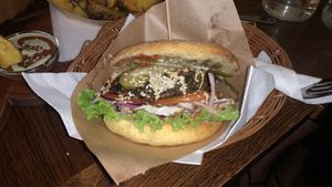 Burger in corn bun  at Public Bar & Vegan Kitchen in Bled