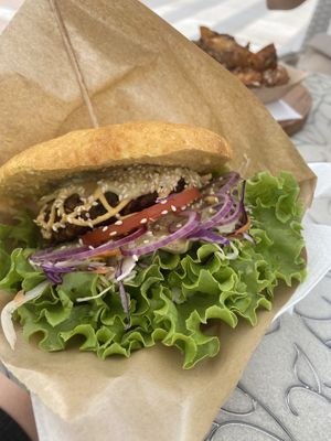 burger with a selfmade patty  at Public Bar & Vegan Kitchen in Bled