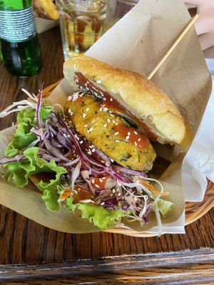 Club burger on corn bun  at Public Bar & Vegan Kitchen in Bled