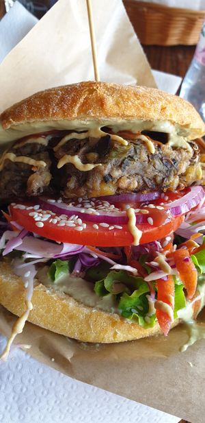 Public burger with corn bun at Public Bar & Vegan Kitchen in Bled