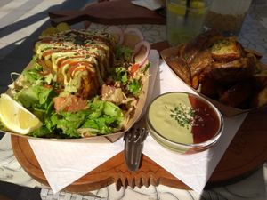 Pie with salad, dips and fries at Public Bar & Vegan Kitchen in Bled