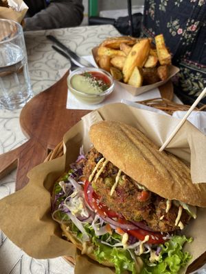 House burger and potato wedges  at Public Bar & Vegan Kitchen in Bled