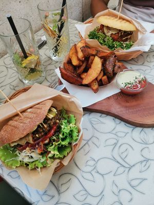 Vegan house burger & public burger with potato wedges at Public Bar & Vegan Kitchen in Bled