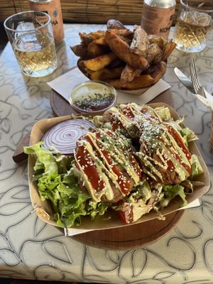 Chickpea fritters and Potato wedges  at Public Bar & Vegan Kitchen in Bled