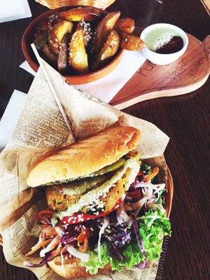 Vegan burger and potato wedges. at Public Bar & Vegan Kitchen in Bled