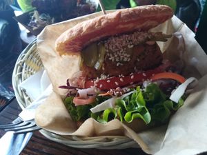 Club Burger with a Corn bun at Public Bar & Vegan Kitchen in Bled