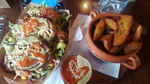 Fritters and potato wedges at Public Bar & Vegan Kitchen in Bled