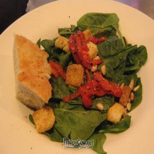 The spinach salad w/o the dressing or cheese.  The pine nuts and roasted peppers make this to die for! at Brixx Wood Fired Pizza - Uptown in Charlotte