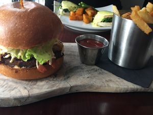 soy bacon cheeseburger burger and fries at Blossom Restaurant Chelsea in New York City