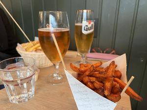 Large normal fries, Small sweet potato fries and two icelandic beer  at Reykjavik Chips in Reykjavik